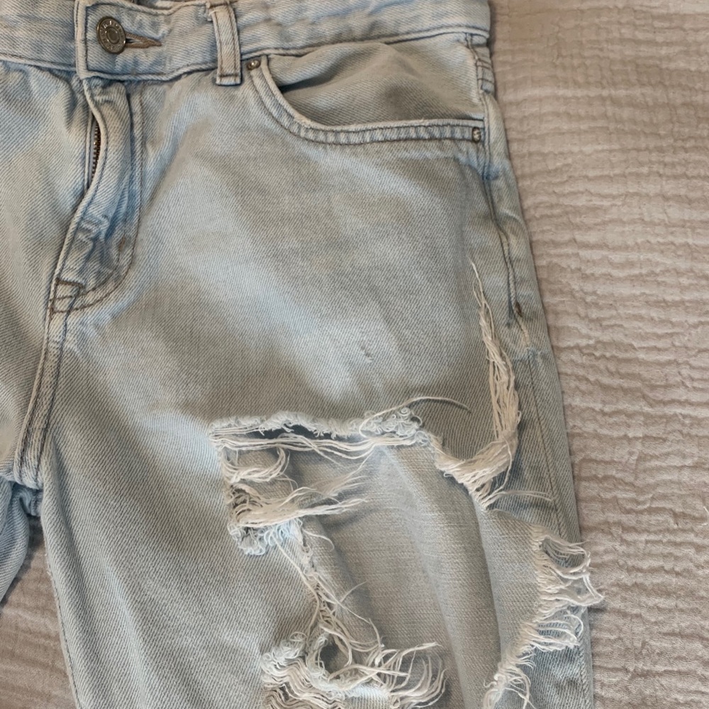 Ultra distressed light demon jeans